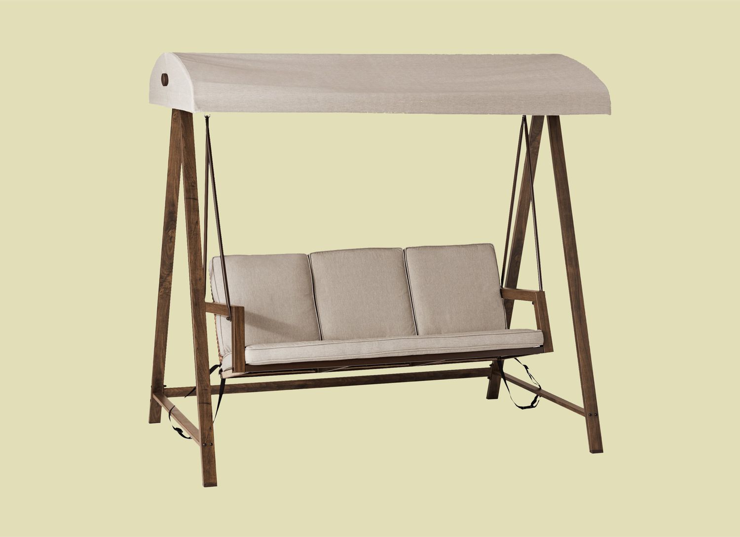 beige porch swing on a light green background